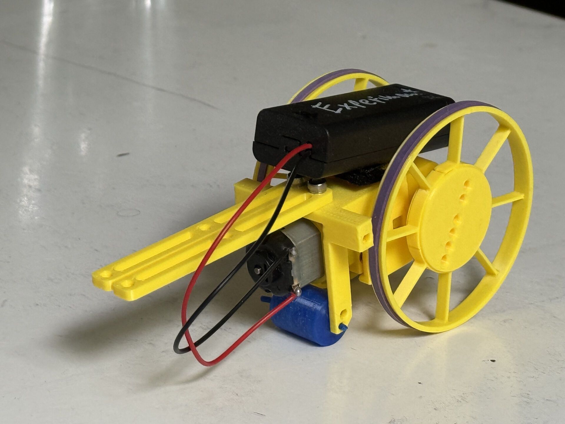 Yellow cannon robot with battery pack and large wheels